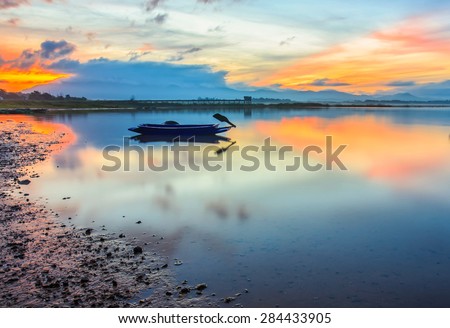 Landscape lake and boats in the morning,lake in Thailand, Asia.