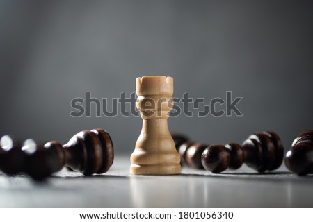 Resilience, perseverance, immunity and victory concept. Staying optimistic. Rook standing among fallen pawns. Photo stock © 