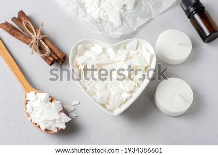 Basic set for home-made natural white eco soy wax candles in glass, wick, perfume. Idea for a hobby, business. Making trendy diy candles without harm to health on white background. 