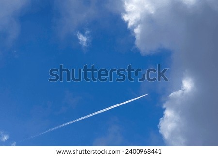 Similar – Image, Stock Photo Condensing stripes in the blue sky over Germany