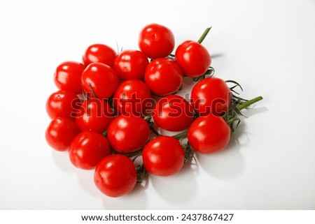 Similar – Image, Stock Photo Fresh panicles of tomatoes on a colourful plate