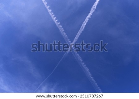 Similar – Image, Stock Photo Crossing contrails in the sky