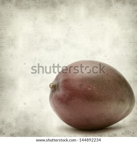 textured old paper background with red rip mango fruit