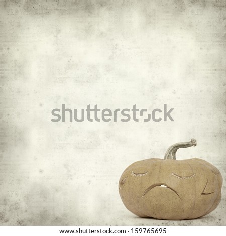textured old paper background  with carved pumpkin