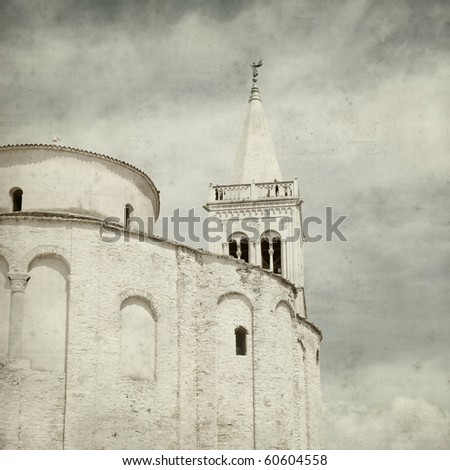 textured old paper background with old church and belltower