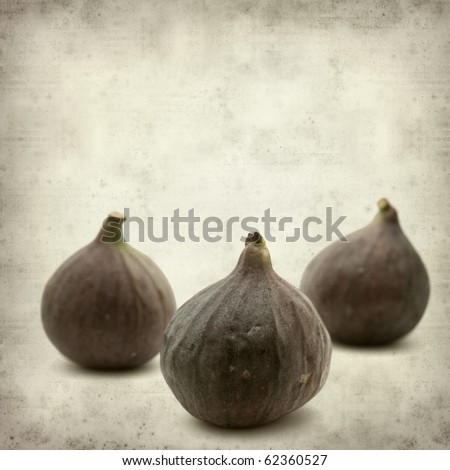 textured old paper background with ripe purple bursa figs fruit