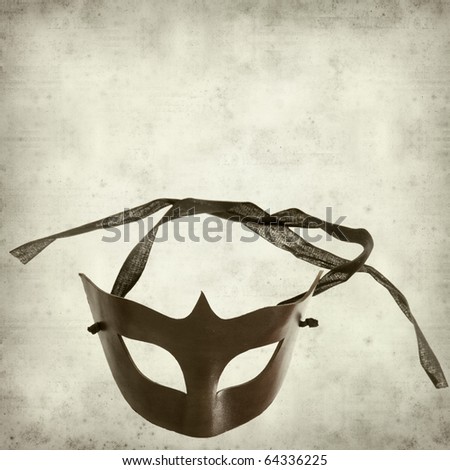 textured old paper background with leather half-mask