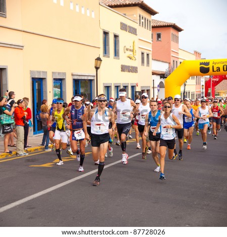 CORRALEJO - OCTOBER 30:  Runners start the race at IIIrd international Fuerteventura half-marathon 30 October, 2011 in Corralejo, Fuerteventura, Spain