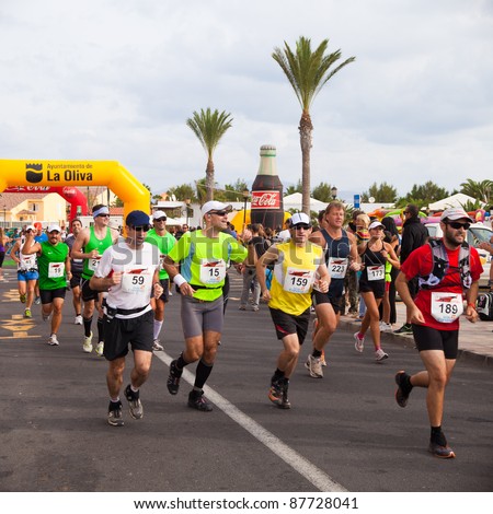 CORRALEJO - OCTOBER 30:  Runners start the race at IIIrd international Fuerteventura half-marathon 30 October, 2011 in Corralejo, Fuerteventura, Spain