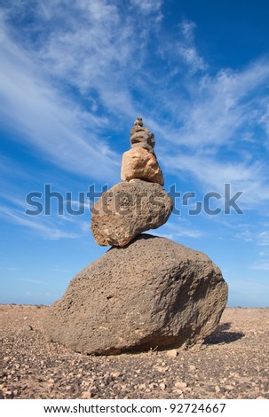 stone piramid (cairn) in volcanic stone desert