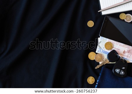 the contents of the pockets of men on a black background