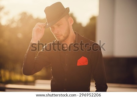 close-up portrait of a successful young man in a hat. backlight. lifestyles