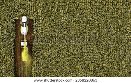 Similar – Image, Stock Photo Combine harvester of an agricultural machine collects ripe golden wheat on the field. Drone Shot. copyspace for your individual text