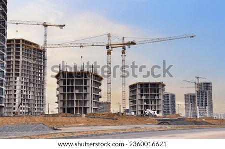 Image, Stock Photo Construction cranes with street lamp in front of a blue sky