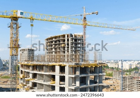 Similar – Image, Stock Photo Skyscraper building construction. Crane working in construction site. Property and real estate development industry. Apartment building construction. Background for REIT fund. Building for rent.