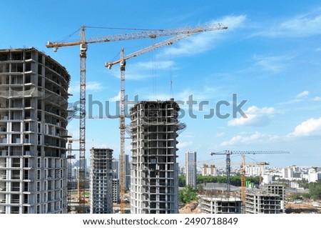 Similar – Image, Stock Photo Skyscraper building construction. Crane working in construction site. Property and real estate development industry. Apartment building construction. Background for REIT fund. Building for rent.