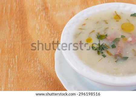 Caldo verde - soup in Portuguese, brazilian cuisine in white plate. Selective focus. Copy space