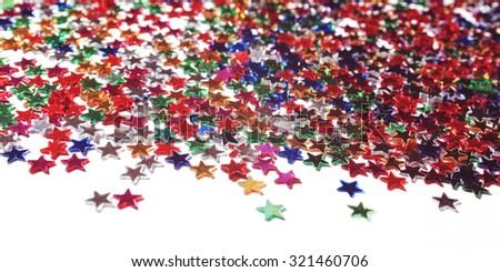 Text frame with heap of colorful stars. Scattering of tiny stars. Macro. Star background with copy space. Aged filter.