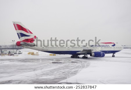 JOHN F. KENNEDY AIRPORT, NEW YORK  9 JANUARY 2015 A Boeing 747 plane from British Airways (BA) is getting ready for take-off after a winter snowstorm at John F. Kennedy International Airport (JFK).