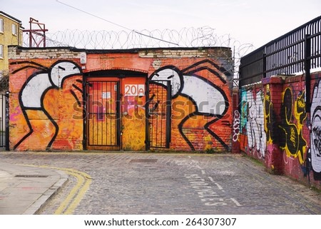LONDON, ENGLAND -12 MARCH 2015- Editorial: Painted walls and graffiti art are scattered in the Brick Lane and Shoreditch area in East London in the heart of Banglatown.