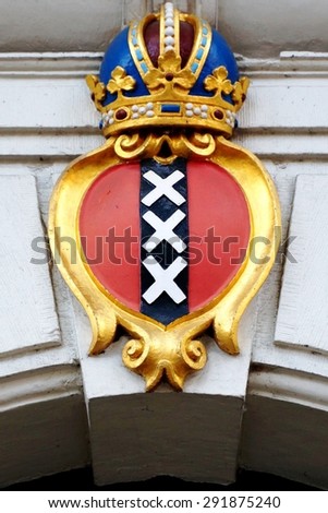 AMSTERDAM, NETHERLANDS -3 JUNE 2014- The coat of arms of Amsterdam, symbol of the Dutch town, is a red shield with three Saint Andrews crosses and the imperial crown of Austria.