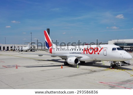 PARIS, FRANCE -13 JUNE 2015- An Embraer 170 jet airplane from the French regional low cost company HOP (A5), a subsidiary of Air France (AF), parked at Roissy Charles de Gaulle airport (CDG)
