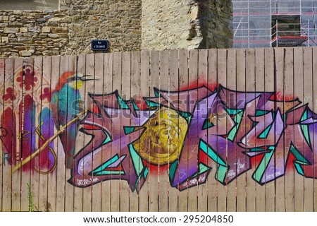 RENNES, FRANCE -4 JULY 2015- Graffiti art on street walls and stores in downtown Rennes, the capital of the Brittany region of France.