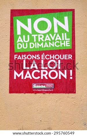PARIS, FRANCE -14 JUNE 2015- Political poster in French saying No to the Macron Law and its provision allowing work on Sunday.