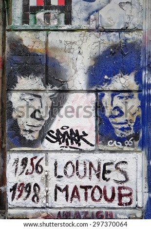 PARIS, FRANCE -15 JUNE 2015- Graffiti art line the street walls and back alleys of the Belleville neighborhood between the 11th and 20th arrondissements of the French capital.
