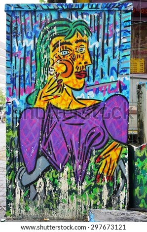 PARIS, FRANCE -18 JUNE 2015- Graffiti paintings by famous street artists line street walls and back alleys in the 13th arrondissement of the French capital.