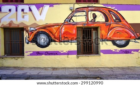 ATHENS, GREECE -14 JULY 2015:  Wall painting of Citroen car on the walls of the building hosting the Citroen Club of Greece in Athens.