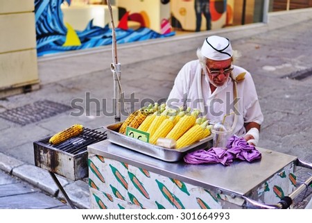 ATHENS, GREECE -14 JULY 2015- Grilled corn on the cob vendor in the street in Athens, Greece.