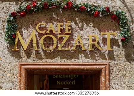 SALZBURG, AUSTRIA -25 JUNE 2015- Famous Austrian composer Wolfgang Amadeus Mozart appears on many tourist souvenirs and restaurants in Salzburg.
