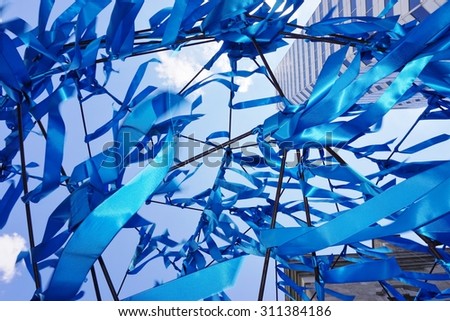 MONTREAL, CANADA -20 AUGUST 2015- La Foret Urbaine (The Urban Forest) blue ribbon art installation in front of the McCord Museum on the campus of McGill University in downtown Montreal.