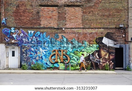 MONTREAL, CANADA -18 AUGUST 2015- Creative graffiti street art murals line the streets and back alleys of Montreal, the largest city in Quebec.