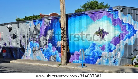MONTREAL, CANADA -18 AUGUST 2015- Creative graffiti street art murals line the streets and back alleys of Montreal, the largest city in Quebec.