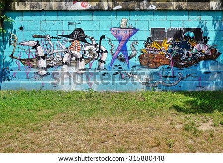 VIENNA, AUSTRIA -24 JUNE 2015- Creative graffiti street art murals line the streets and back alleys of Vienna, the capital of Austria, especially along the banks of the Danube River and its canals.