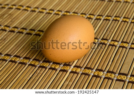 Close up of egg on bamboo mat for  cook.