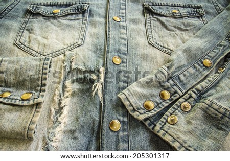 Close up of denim shirt old classic worn and frayed detail