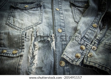 Close up of denim shirt old classic worn and frayed detail