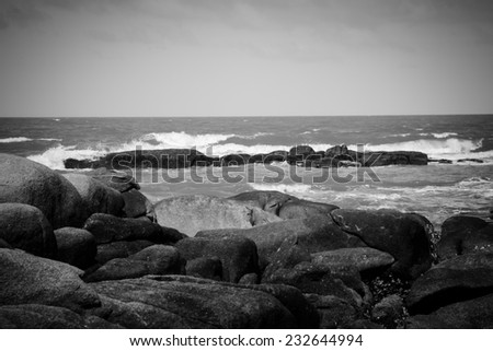 Beautiful beach with rock in Thailand on black and white photography