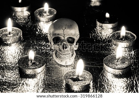 Burning candles and skull, halloween,black and white