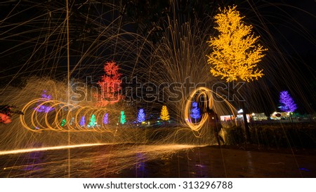 Fire spinning from steel wool during night scape activity at Ipoh, Perak, Malaysia.