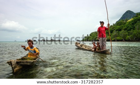 SEMPORNA, MALAYSIA - 20TH SEPTEMBER 2013;  Sea Bajau children  in remote island of Sabah, Malaysia.The Sea Bajau children here do not attend school due to lack of resources.