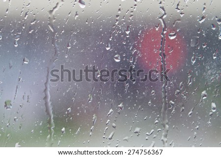 Dirty window glass with water vapor and raindrop during a rainstorm.