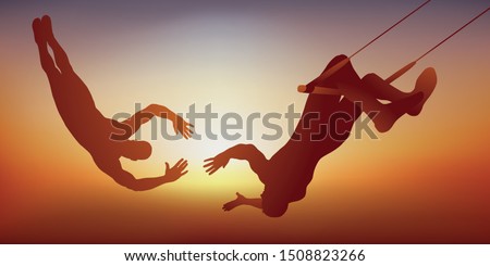 The concept of trust in his partner, with a circus show duo showing two trapeze artists who make a number of acrobatics. Stock foto © 