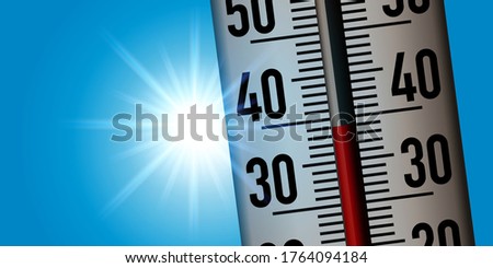 Concept of the heat wave with a thermometer taken in close-up to show the rise in temperatures following global warming.