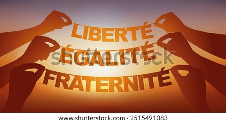 Concept of democracy with hands holding a garland on which is written the motto of the French republic.