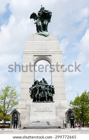 OTTAWA, CANADA - May 26, 2015: Ceremonial guards stand ground at the base of the War Memorial & tomb of the unknown soldier