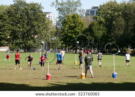 KINGSTON, CANADA - September 20, 2015: Mixed players from Queen\'s University practice the game of quidditch from the Harry Potter series